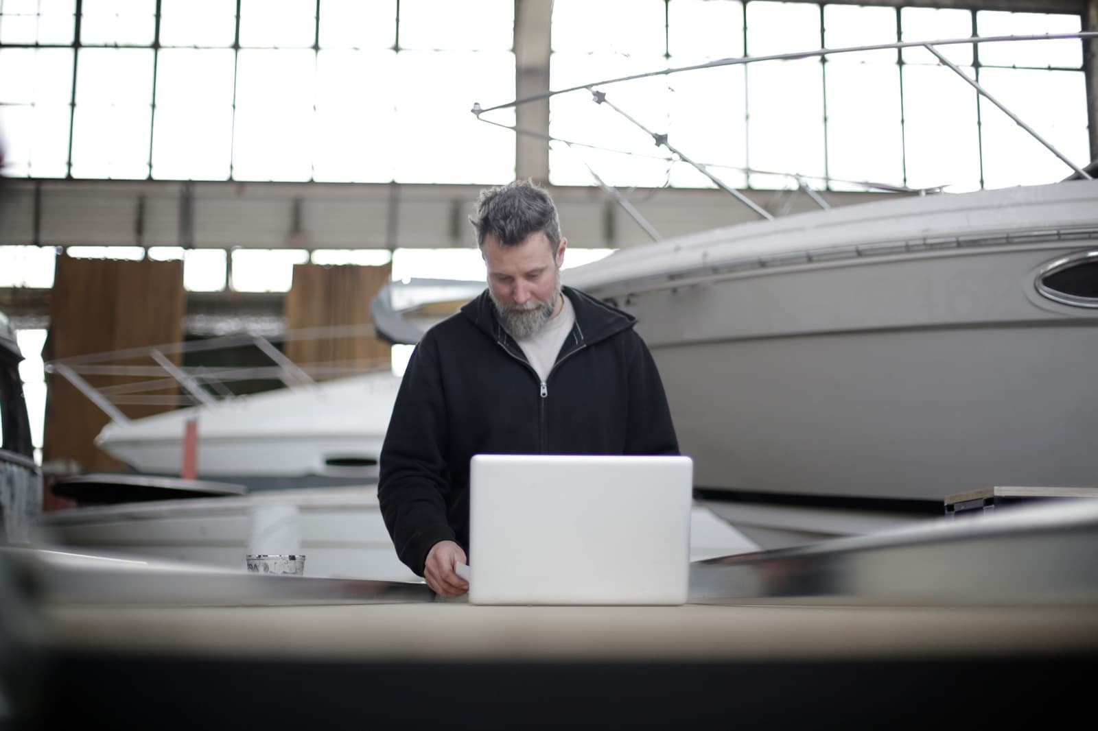 A marine business owner at work among the boats